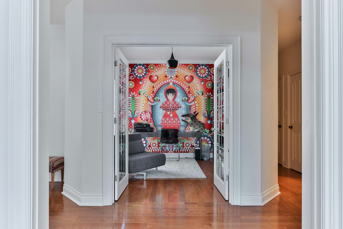 home office featuring a colorful wall mural